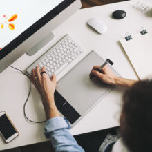 Young graphic designer working in office